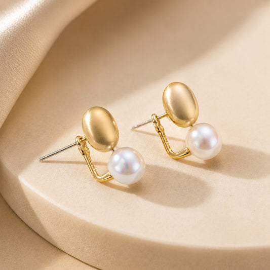 Detailed view of the innovative front-back design on 18K gold-plated freshwater pearl stud earrings with 925 silver posts.