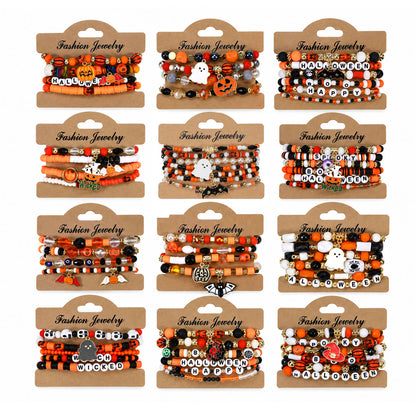 Overview of complete 12 sets Halloween stackable beaded bracelet pack with pumpkin, ghost, and letter beads