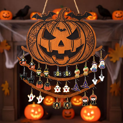 Halloween drop dangle earrings hanging on a carved wooden pumpkin jewelry organizer