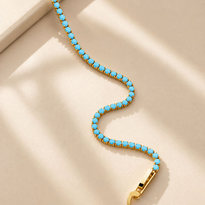 Flexible-K-gold-finished-copper-tennis-bracelet-with-minimalist-turquoise-stones-showing-premium-jewelry-details