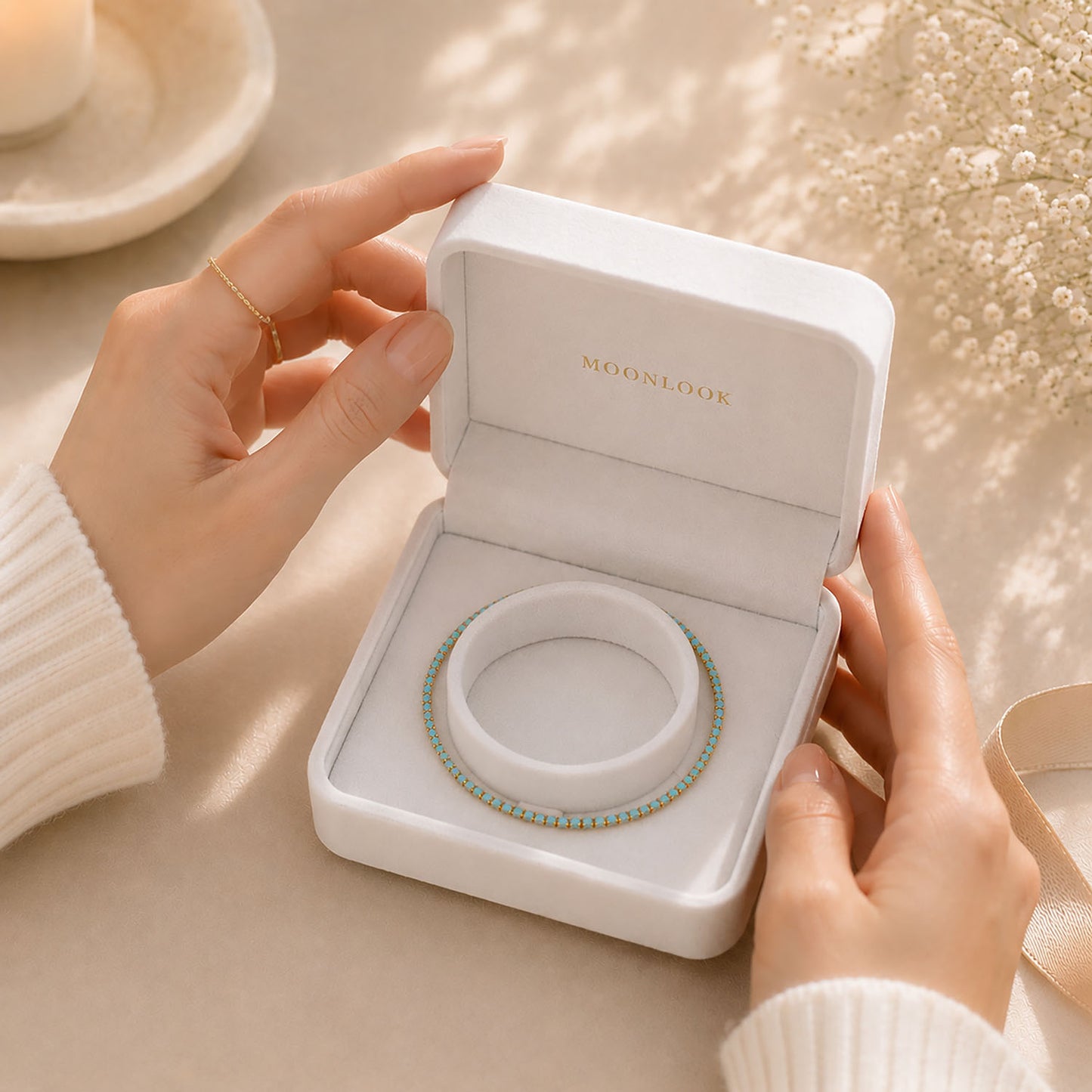 Premium-gift-ready-white-jewelry-box-presenting-a-minimalist-turquoise-tennis-bracelet-for-elegant-gifting