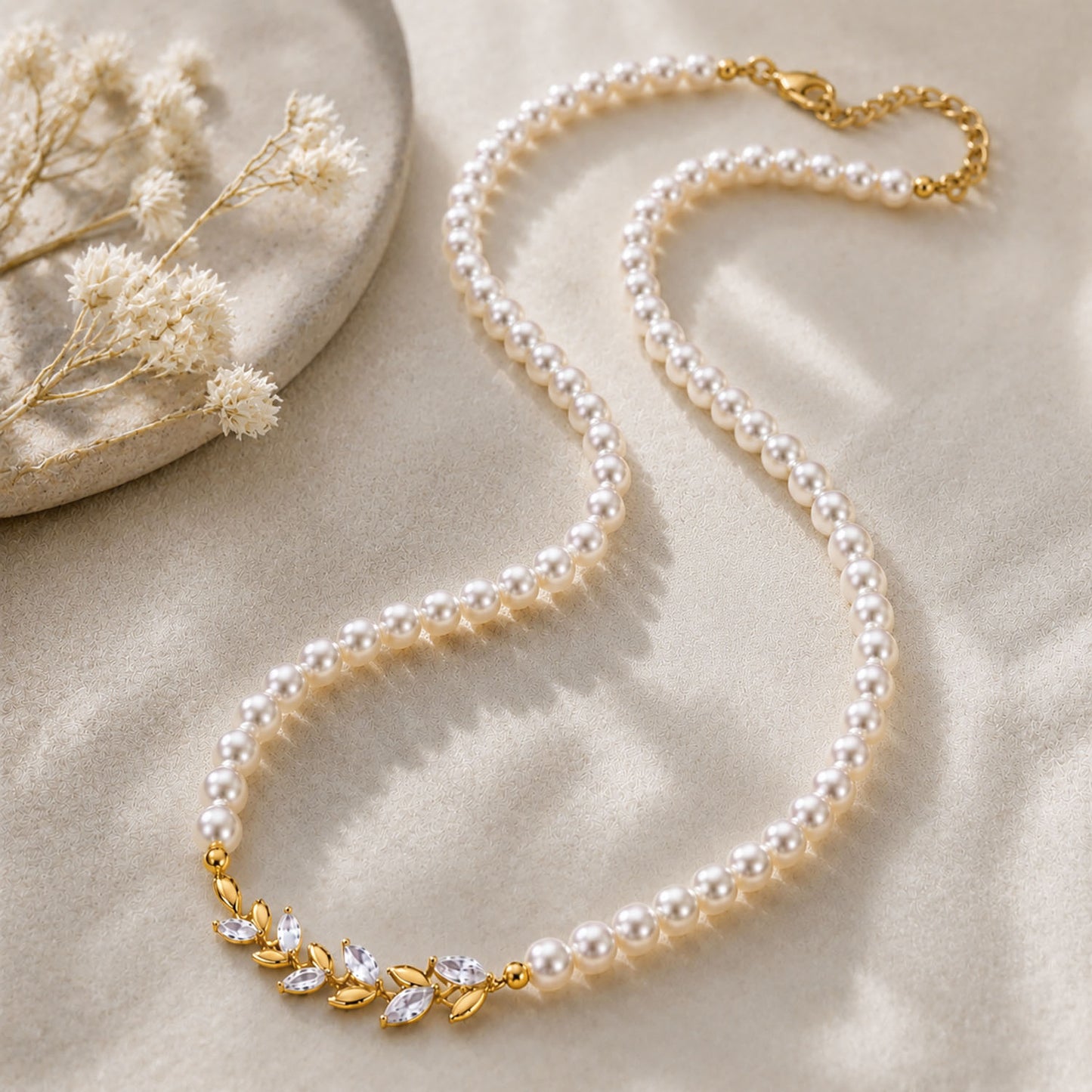 Elegant vintage pearl choker necklace resting beautifully on a textured aesthetic stone surface in warm sunlight.