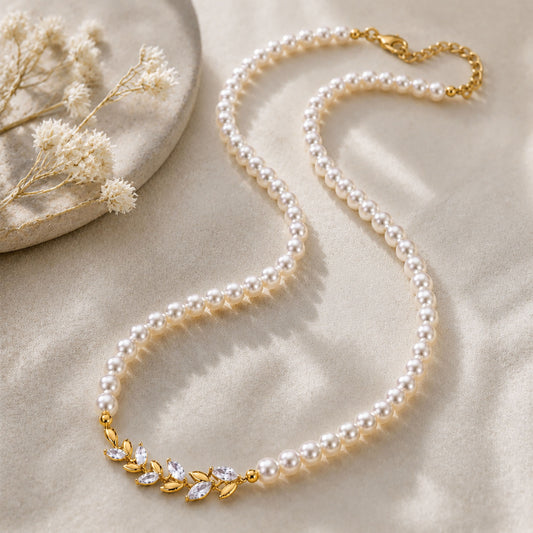 Elegant vintage pearl choker necklace resting beautifully on a textured aesthetic stone surface in warm sunlight.