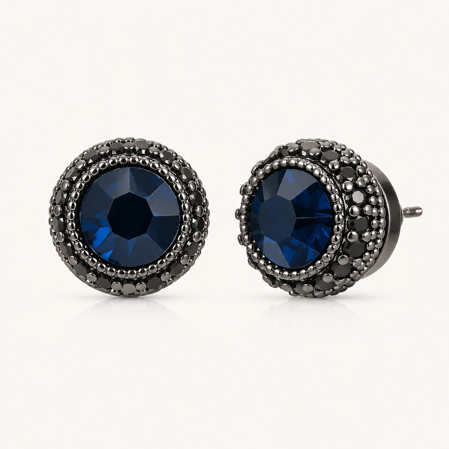 Striking 10mm black cubic zirconia halo stud earrings on a minimalist white background.