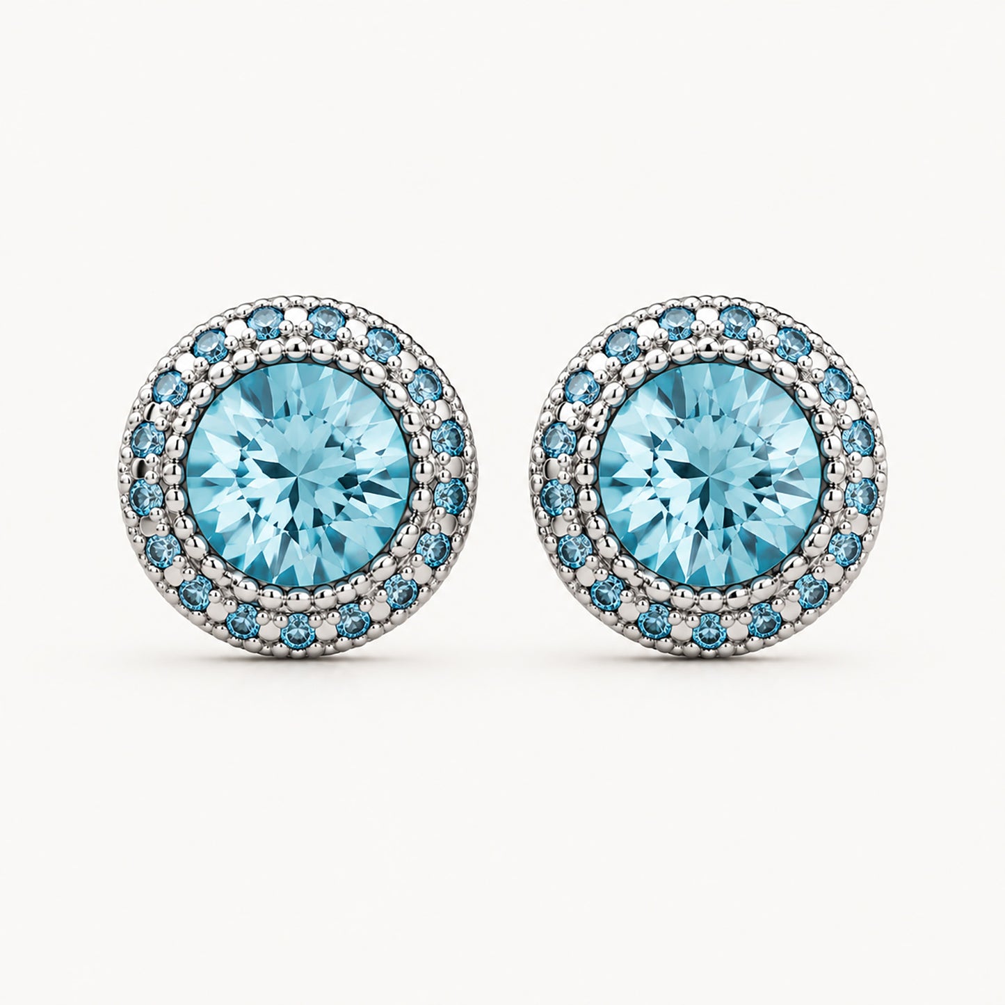 Brilliant 10mm blue cubic zirconia halo stud earrings on a clean minimalist white background.