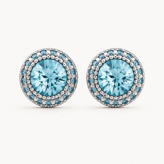 Brilliant 10mm blue cubic zirconia halo stud earrings on a clean minimalist white background.