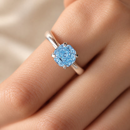 Extreme close-up of multi-faceted 8mm ice blue cubic zirconia gem on silver plated adjustable band