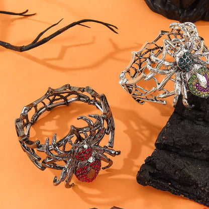 Pair of gothic spiderweb stretch bracelets in crimson red and colorful rhinestones on wood and stone