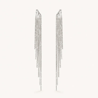 Front view of platinum plated crystal waterfall tassel drop earrings with irregular multi-strand fringe.