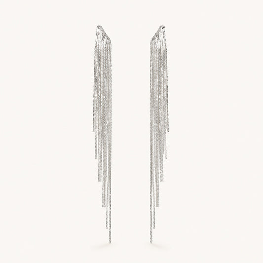 Front view of platinum plated crystal waterfall tassel drop earrings with irregular multi-strand fringe.