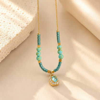 Close-up of water-resistant titanium steel anklet with blue beads and sparkling zirconia.