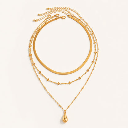 Gold 3 piece layered necklace set featuring herringbone snake chain and teardrop pendant