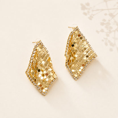 Flatlay view of pair of gold plated liquid metal mesh scarf rhombus stud earrings with pave CZ crystals