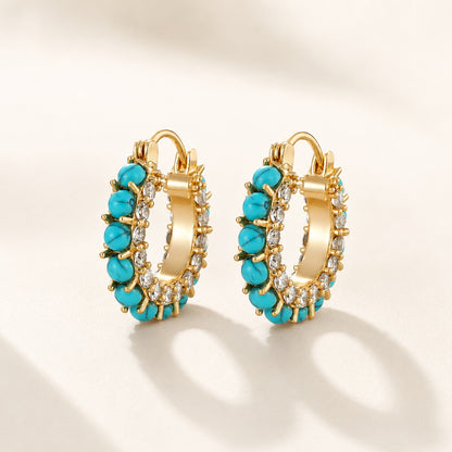Flatlay view of pair of 2cm gold plated turquoise bead and pave cz hoop earrings
