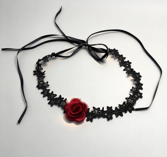Gothic black bat-pattern lace choker with red rose and long satin tie ribbons on white background