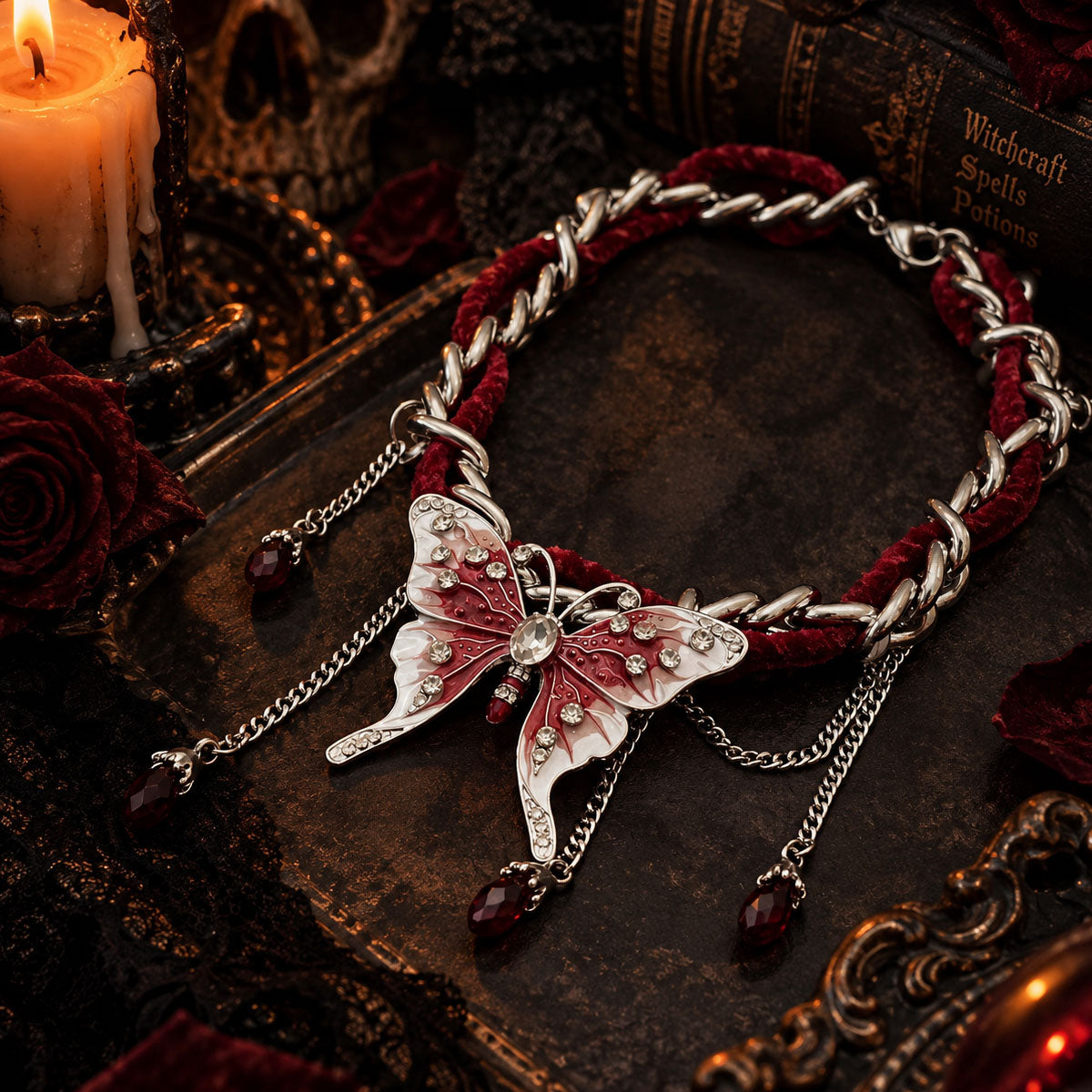 Gothic red velvet butterfly choker lying on vintage spell book surrounded by red roses and candles