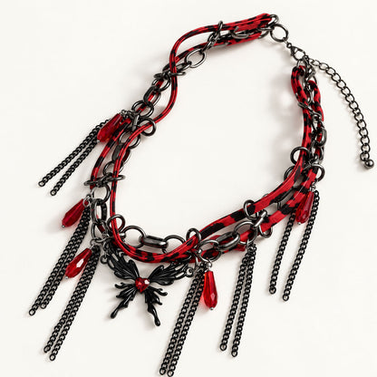 Gothic black and red leather chain butterfly choker with crimson acrylic drops on white background
