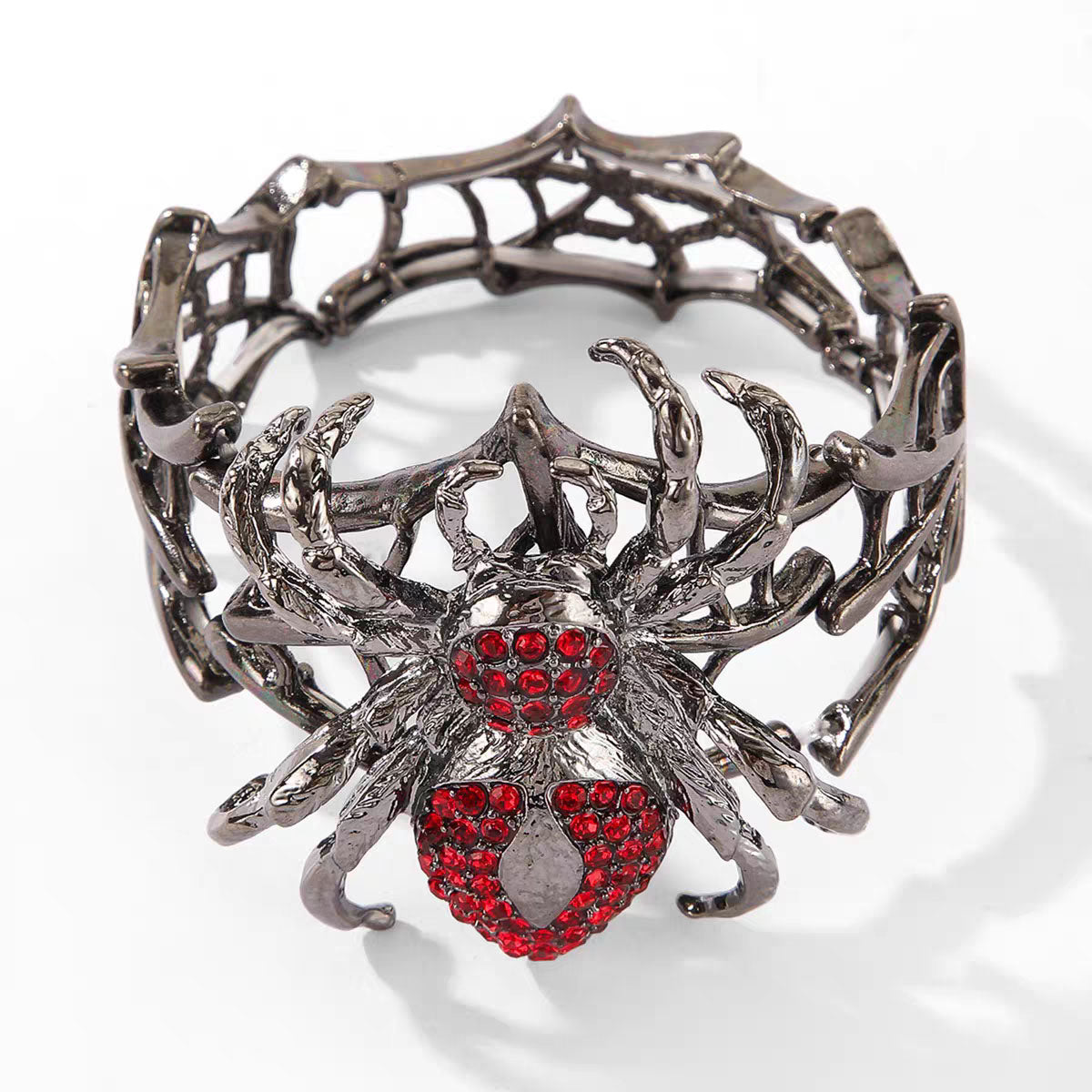 Gothic dark alloy spiderweb stretch bracelet featuring crimson rhinestone spider on white background