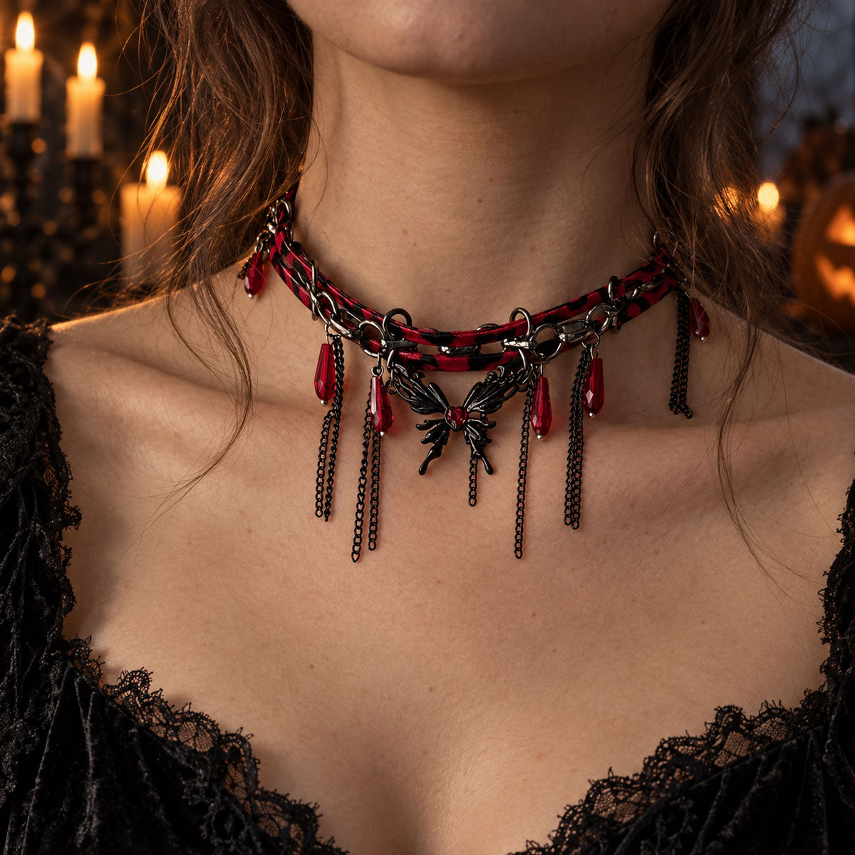 Close-up of model wearing vampire gothic leather chain butterfly necklace in candlelit Halloween setting