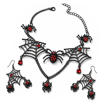 Flat lay view of gothic black metal spiderweb necklace and earring set with red rhinestones