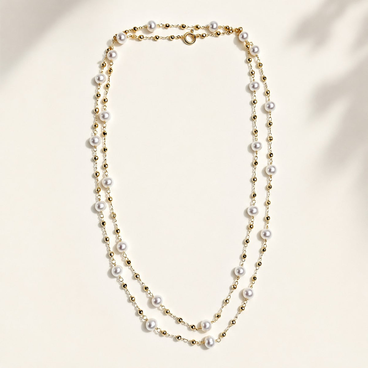 80cm freshwater pearl station long opera necklace with platinum white gold plated beaded chain laid flat