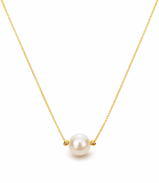 Minimalist gold-tone necklace with a single lustrous aurora pearl on a white background.