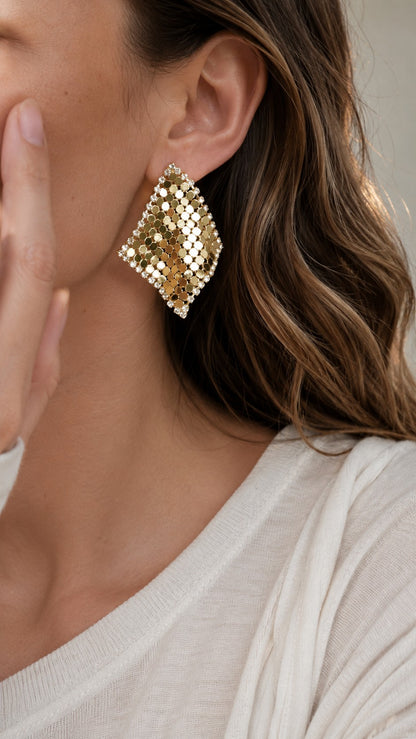 Side view close up of model with wavy blonde hair wearing 4.3cm gold metal mesh scarf rhombus stud earrings