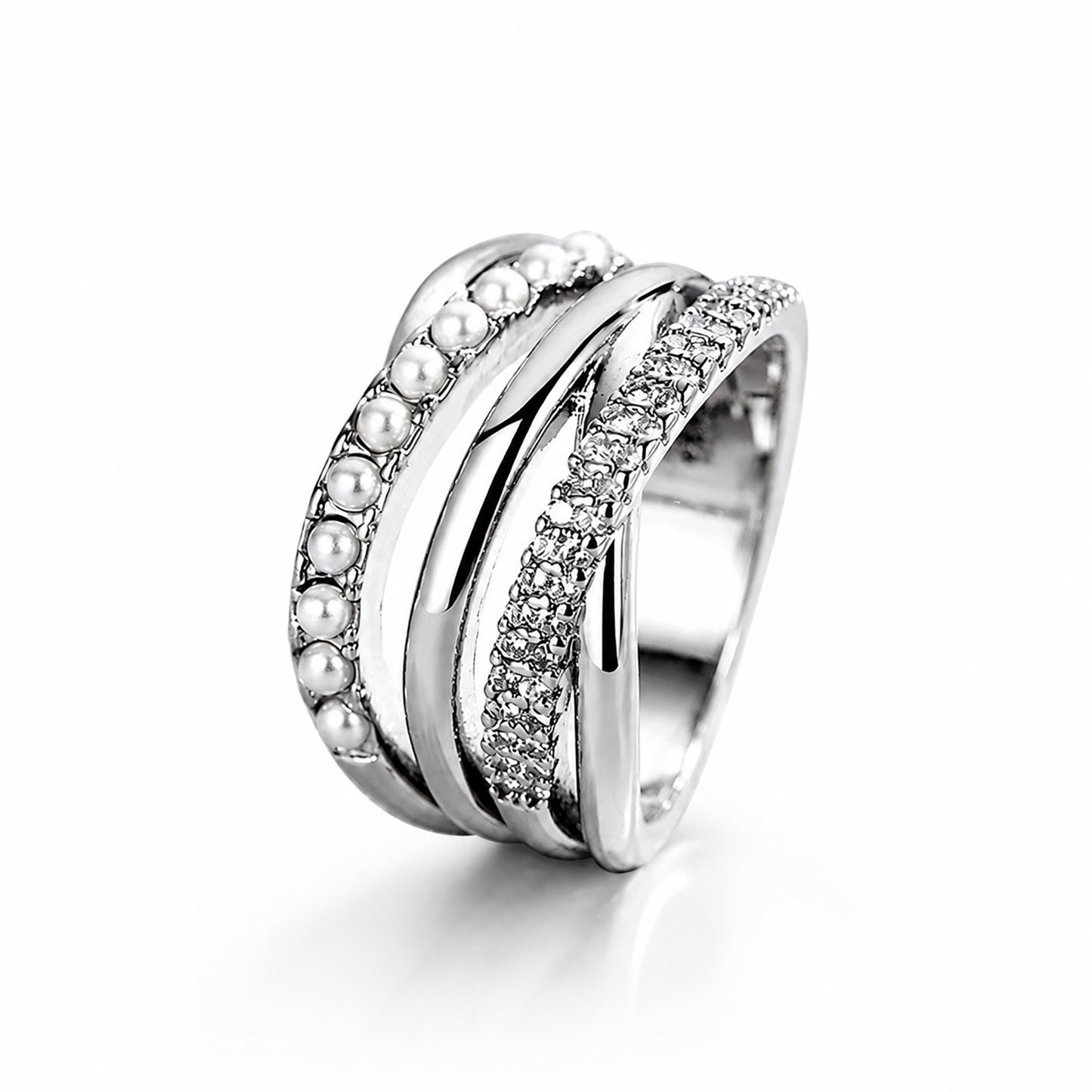 Minimalist studio shot of a complex silver-tone multi-strand ring accented with cubic zirconia and crystal pearls on a clean white background.