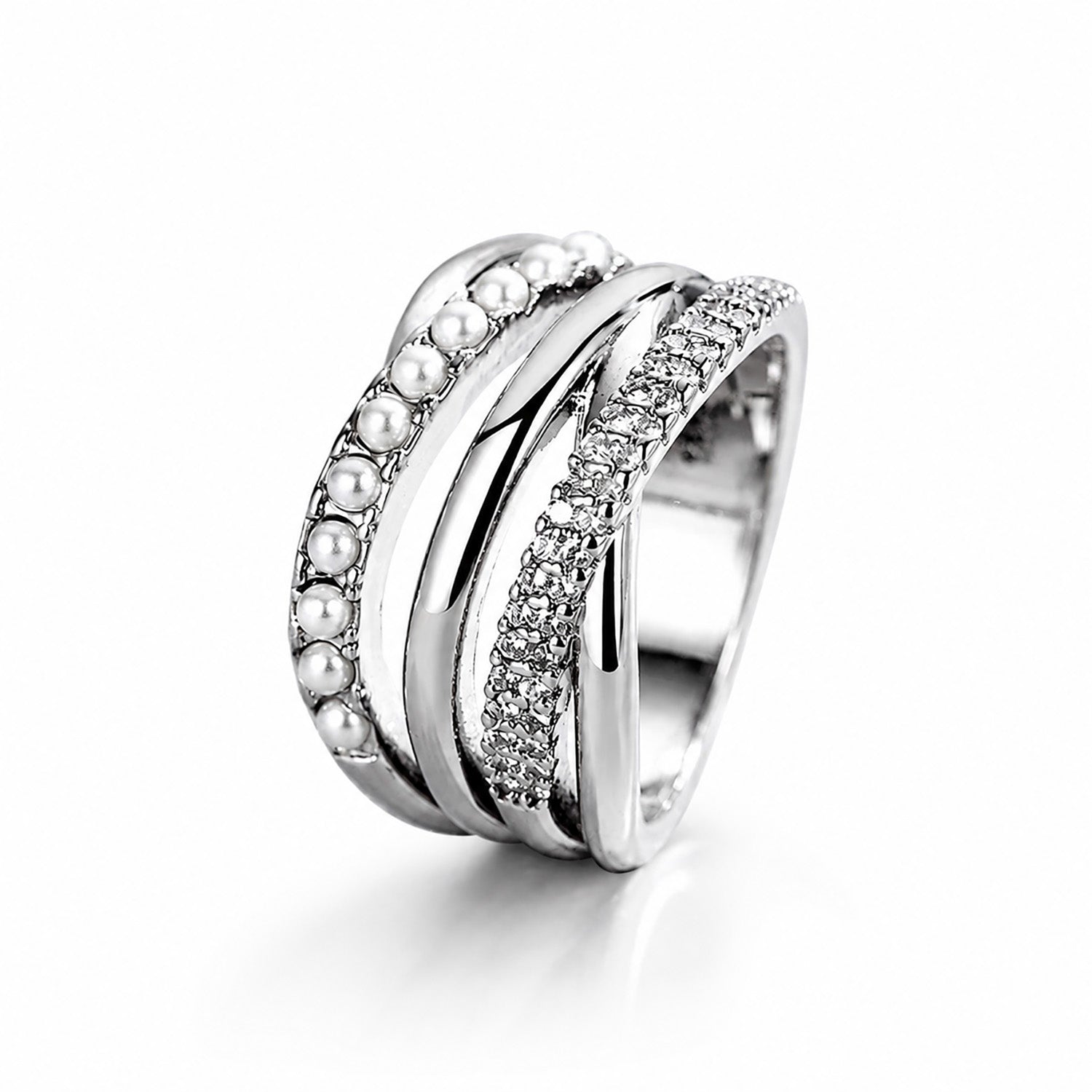 Minimalist studio shot of a complex silver-tone multi-strand ring accented with cubic zirconia and crystal pearls on a clean white background.