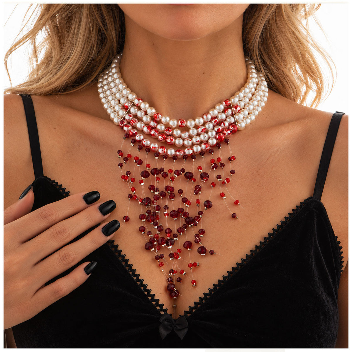Model wearing bloody white pearl multi-layer choker necklace with red crystal drips paired with black corset dress