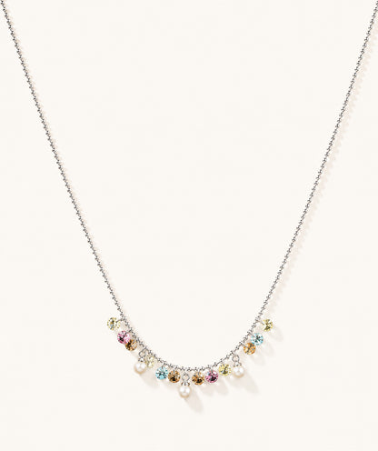 Minimalist white gold-tone necklace featuring a pastel rainbow zirconia and pearl fringe on a clean white background.