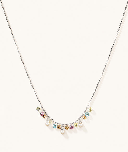 Minimalist white gold-tone necklace featuring a pastel rainbow zirconia and pearl fringe on a clean white background.