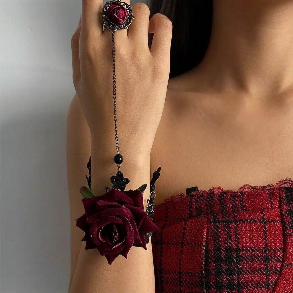 Model wearing gothic red rose hand harness slave bracelet connected from wrist to finger ring