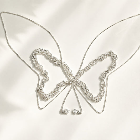 110cm silver lace adjustable slider necklace laid out in a butterfly shape on white silk background